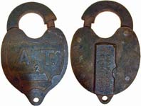 “A.T. 2” – “CLOSE THE LOCK TO GET KEY OUT”. 2 1/2″ wide. 13/16″ deep. Steel body