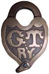 “G.T. R’Y.”. Brass body. Brass shackle.