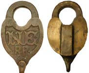 “N.E. R•R•”. Brass body. Brass shackle.