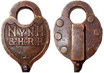 “N.Y.N.H.&H.R.R”. Brass body. Brass shackle.
