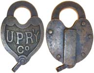 “U.P.R’Y. Co.”. 2 5/8″ wide. Brass body. Brass shackle.