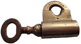 “J. L & SON I.B.L.W”. 1 1/2″ high x 2 3/4″ wide. Brass body. Brass shackle. Nick