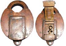 "U.S. INT REV". 4" high x 2 3/4" wide. Brass body. Brass shackle. A paper seal p