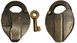 “U.S. INT REV”. 3 7/8″ high x 2 1/2″ wide. Brass body. Brass shackle. A paper se