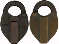 “U. S. INT REV”. 3 7/8″ high x 2 1/2″ wide. Brass body. Brass shackle. A paper s