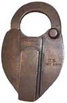 “U.S. INT REV”. 3 7/8″ high x 2 1/2″ wide. Brass body. Brass shackle. A paper se