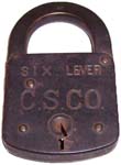 “C.S.CO. SIX LEVER”. 3 1/4″ high x 2″ wide. Stamped Steel body. Steel shackle. T
