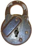 “S.P.CO.”. 3″ high x 2″ wide x 1/2″ deep. Stamped Steel body. Steel shackle. Pos
