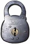 “T. M. C. SIX LEVER KANSAS CITY MO” – Flat Key. 3″ high. Stamped Steel body. Ste