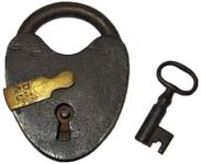 “D. M & Co”. 3 1/4″ high x 2 3/8″ wide. Iron body. Iron shackle. The reverse of