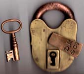 “D. M & Co”. 3 5/8″ high x 2 3/8″ wide. Brass body. Brass shackle. Original key.