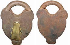 “M. W Co”. 4″ high. 2 5/8″ wide. Iron body. Iron shackle.