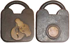 “M. W & Co”. 3″ high x 2 1/8″ wide. Iron body. Iron shackle.