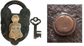 “M. W & Co”. 4″ high x 2 5/8″ wide x 3/4″ deep. Iron body. Iron shackle.