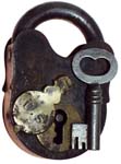 “U. S.”. 3 5/8″ high x 2 3/8″ wide x 27/64″ shackle diameter. Iron body. Iron sh