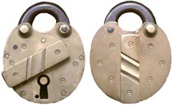 “W. C. SINCLAIR”. 3 3/4″ high x 3″ wide x 1″ deep. Brass body. Steel shackle. “W