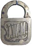 “J. W. M.”. Brass body. Brass shackle.