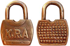 “K.R.A”. 2 1/2″ high. Brass body. Brass shackle.