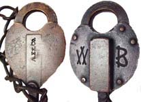 “A.EX.CO.”. 2 1/2″ wide. Brass body. Brass shackle. Catalog #: 115.