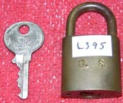 “B. S.”. 2″ high x 1 1/4″ wide. Brass body. Brass shackle.