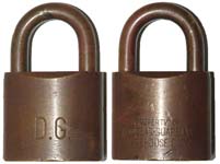 “D.G.” – “PROPERTY OF DOUGLAS-GUARDIAN WAREHOUSE CORP.”. 1 3/4″ wide. Brass body