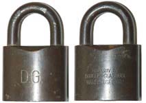 “D.G.” – “PROPERTY OF DOUGLAS-GUARDIAN WAREHOUSE CORP.”. Brass body. Bronze shac