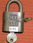 “N. Y. CITY”. 3″ high x 1 3/4″ wide. Brass body. Brass shackle.