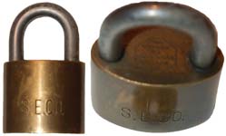 “S. E. CO.”. 1 1/2″ wide. Brass body. Steel shackle. Catalog #: 620.